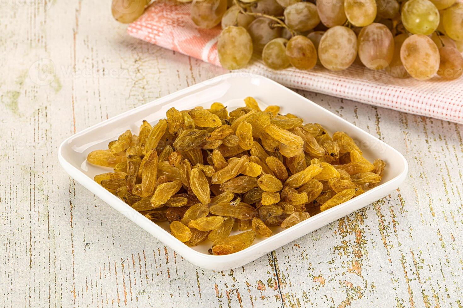 A bowl of dried grapes photo