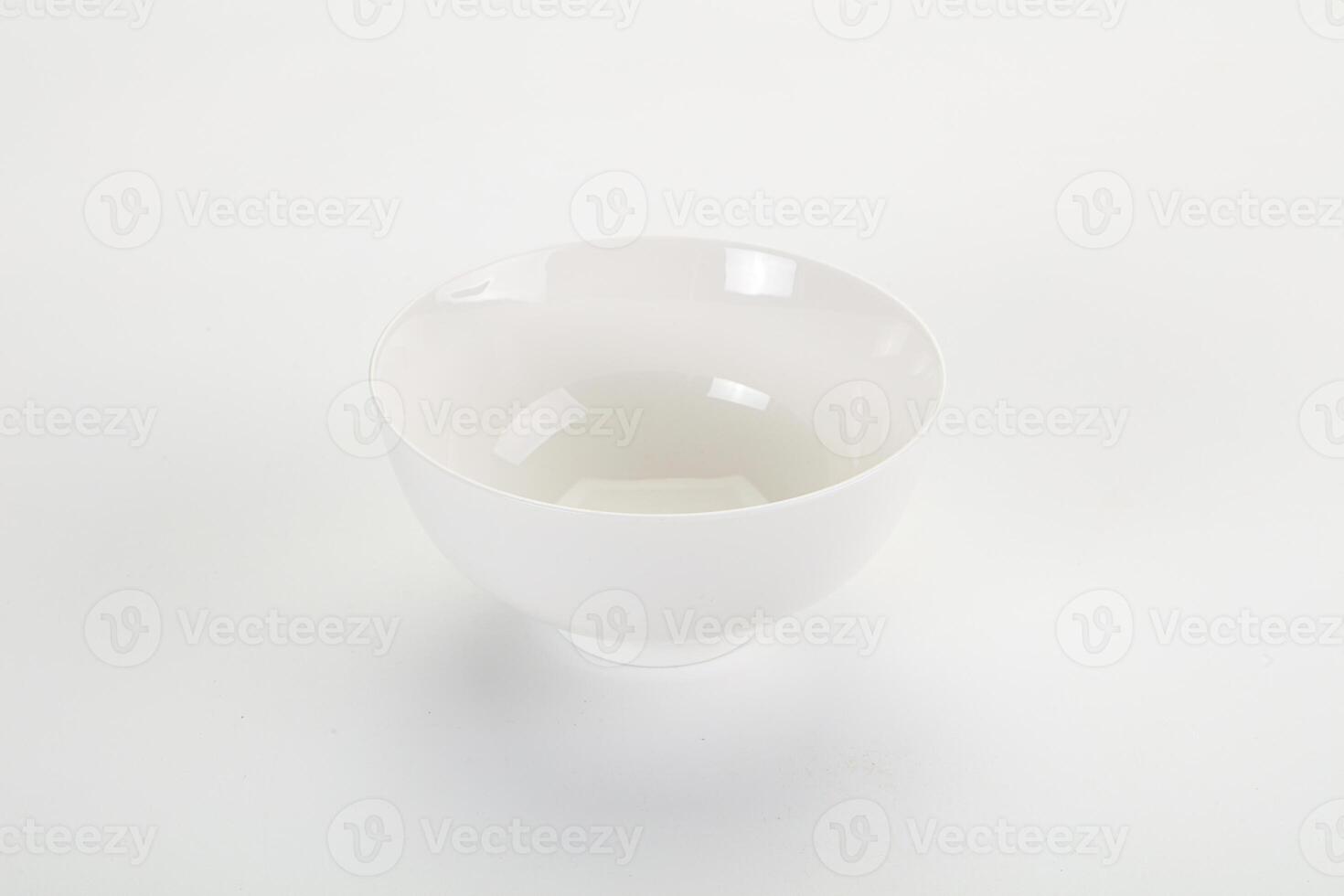 A white bowl sitting on a table photo