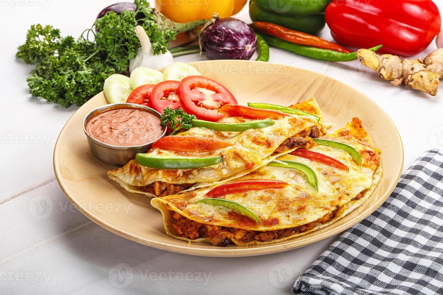 A plate of food with vegetables and dip photo
