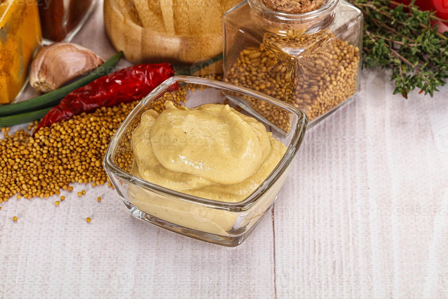 A table with a variety of spices and condiments photo