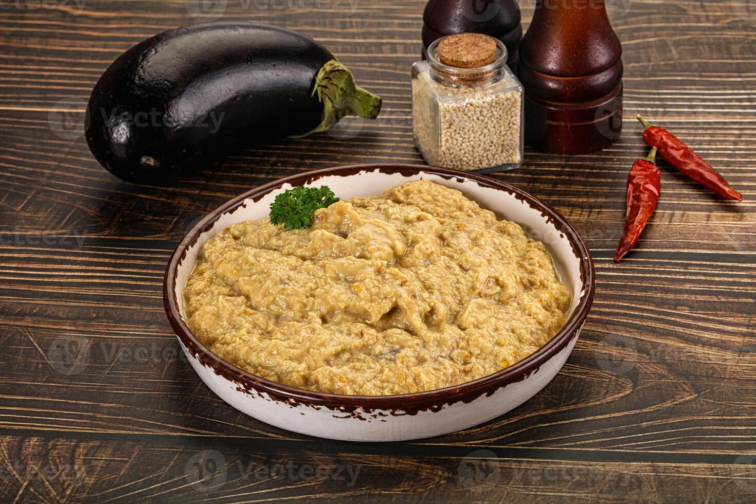 A bowl of mashed potatoes and a bowl of eggplant photo