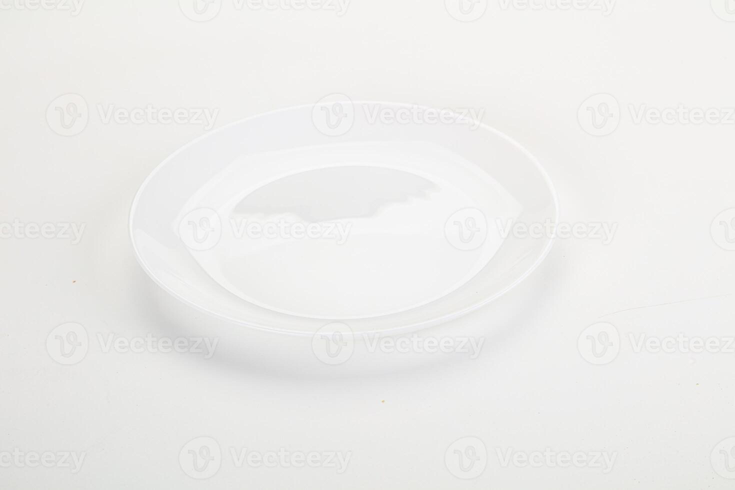 A white plate with a small hole in it photo