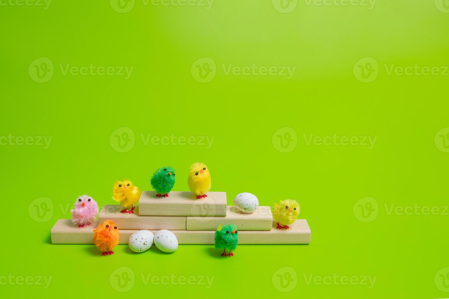 Small plastic toys on a green background photo