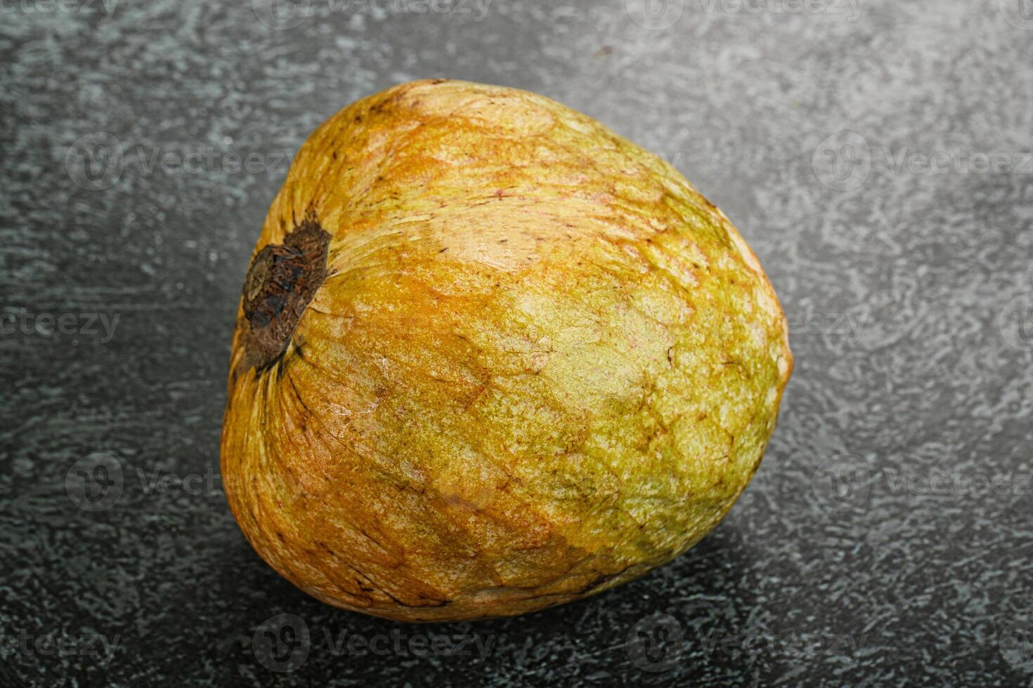 A brown and green fruit photo