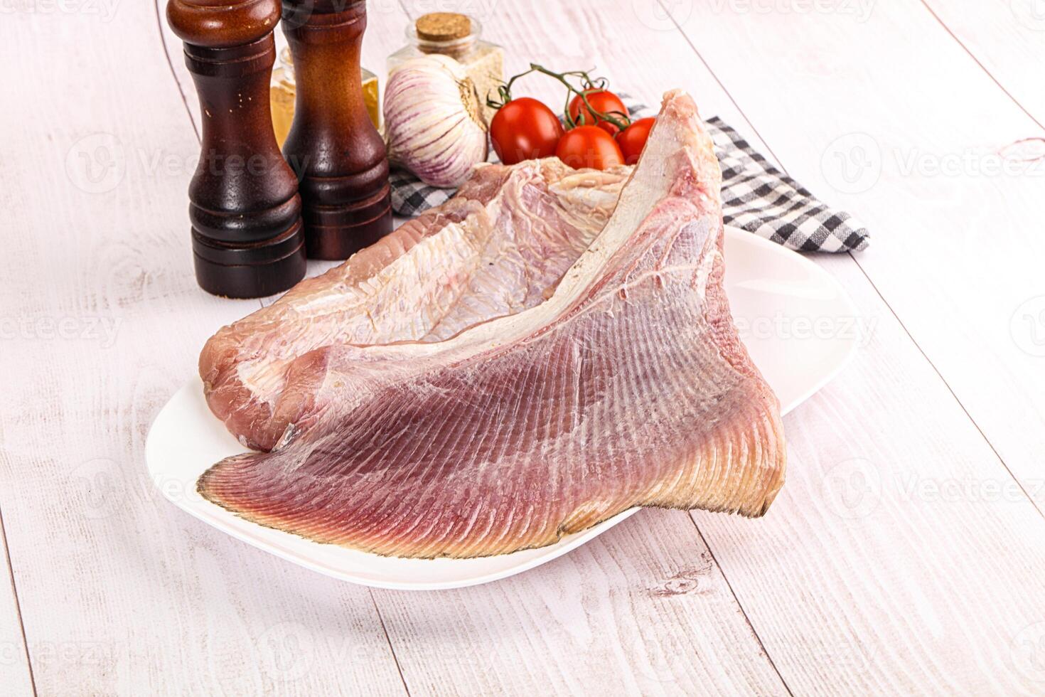 A plate with a piece of fish on it photo