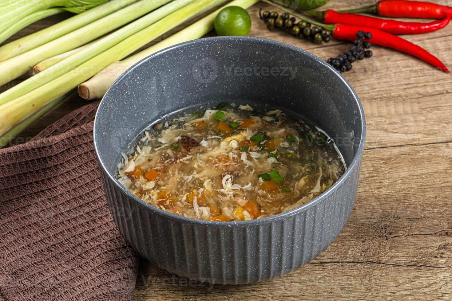 A bowl of soup with vegetables and other ingredients photo