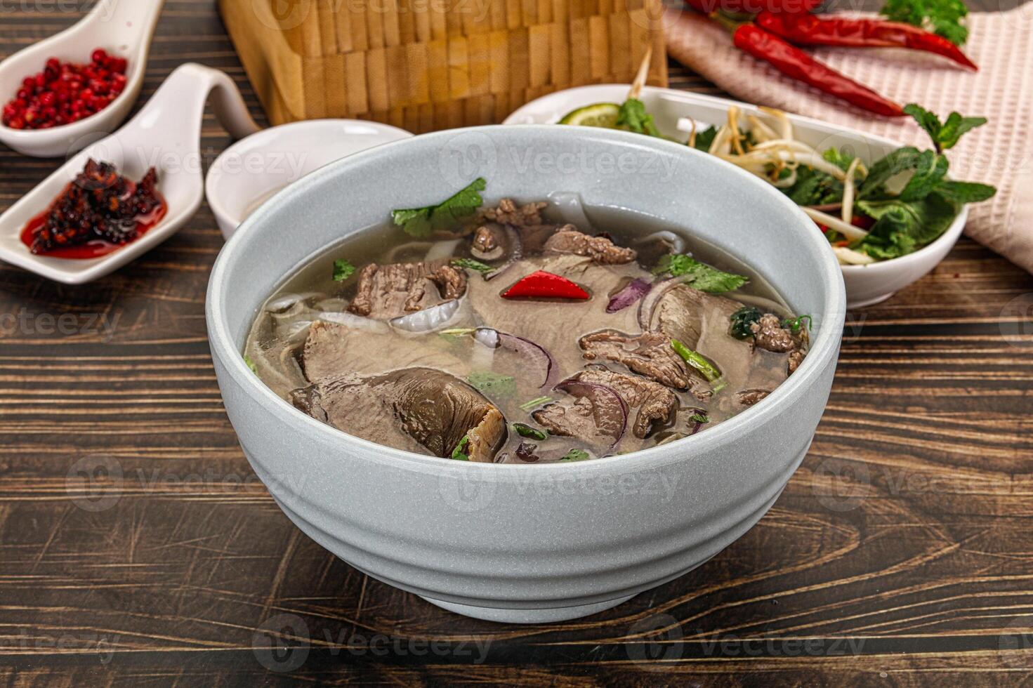 A bowl of soup on a table photo