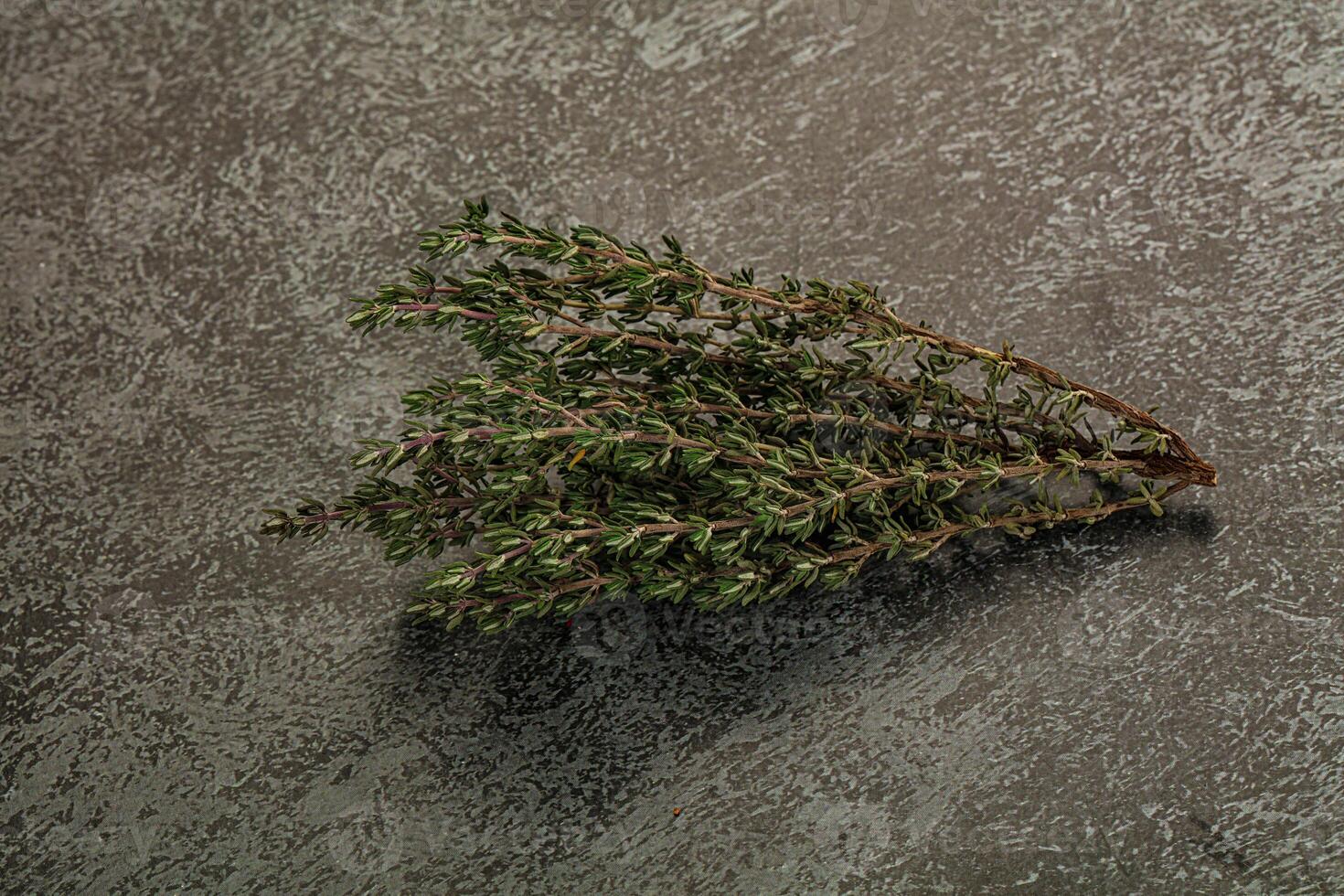 A bunch of herbs on a table photo