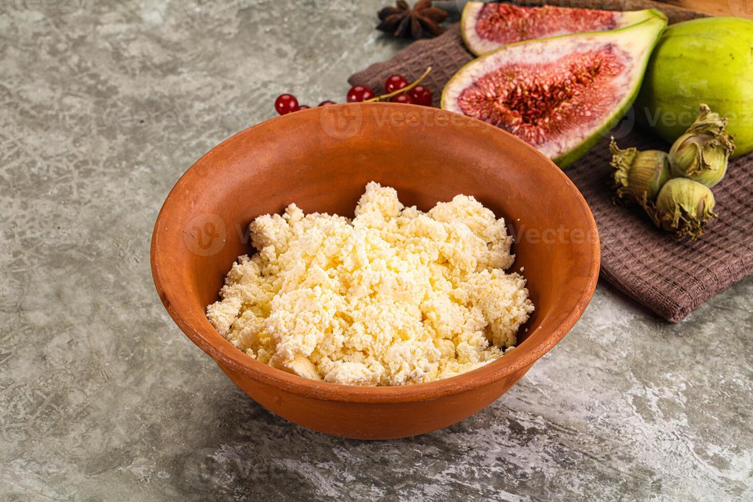 A bowl of rice next to a bowl of figs photo