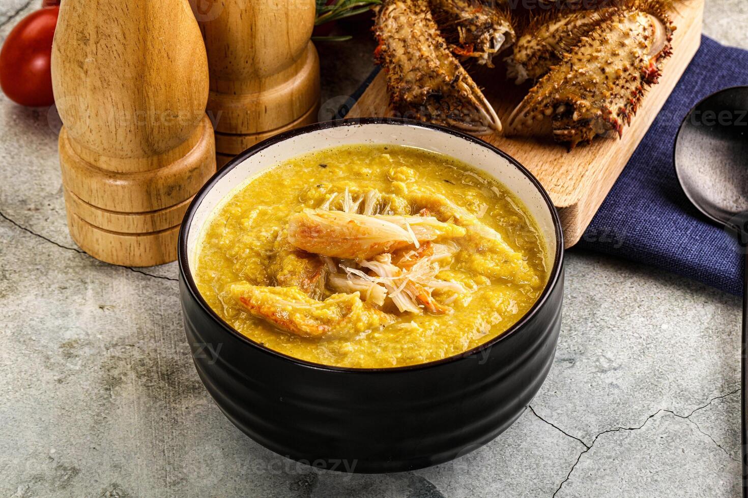 A bowl of soup with shrimp and vegetables photo