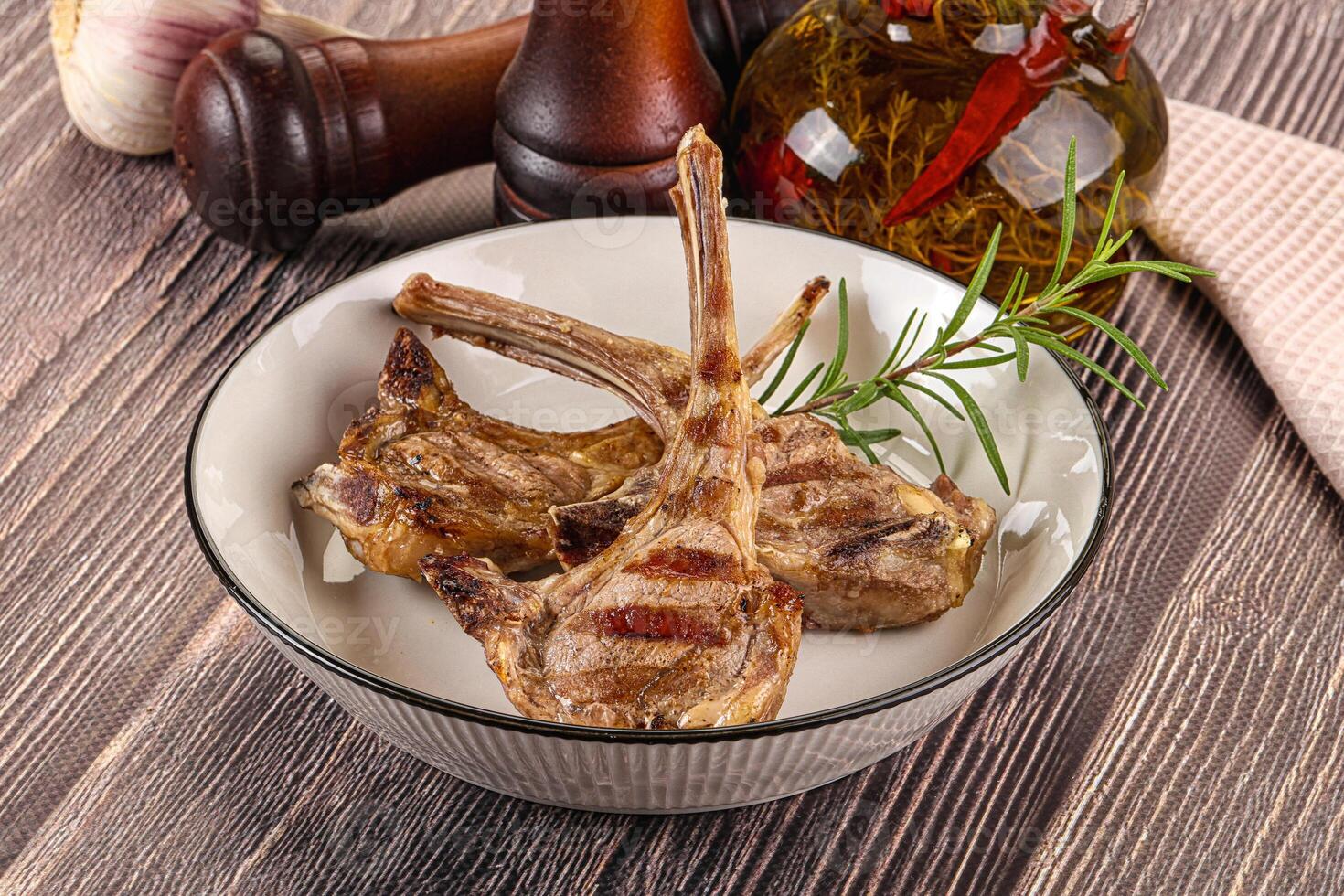 A plate of meat and vegetables on a table photo