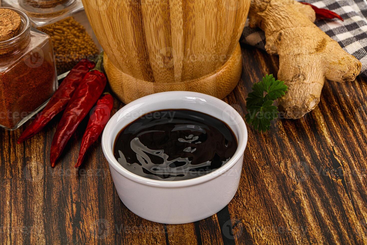 A cup of coffee and spices on a table photo