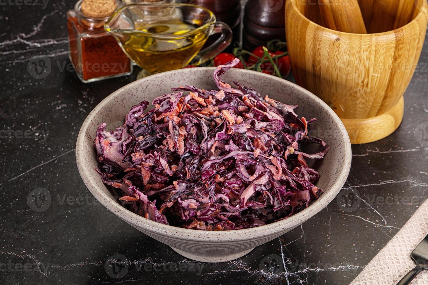 A bowl of red cabbage sitting on a table photo