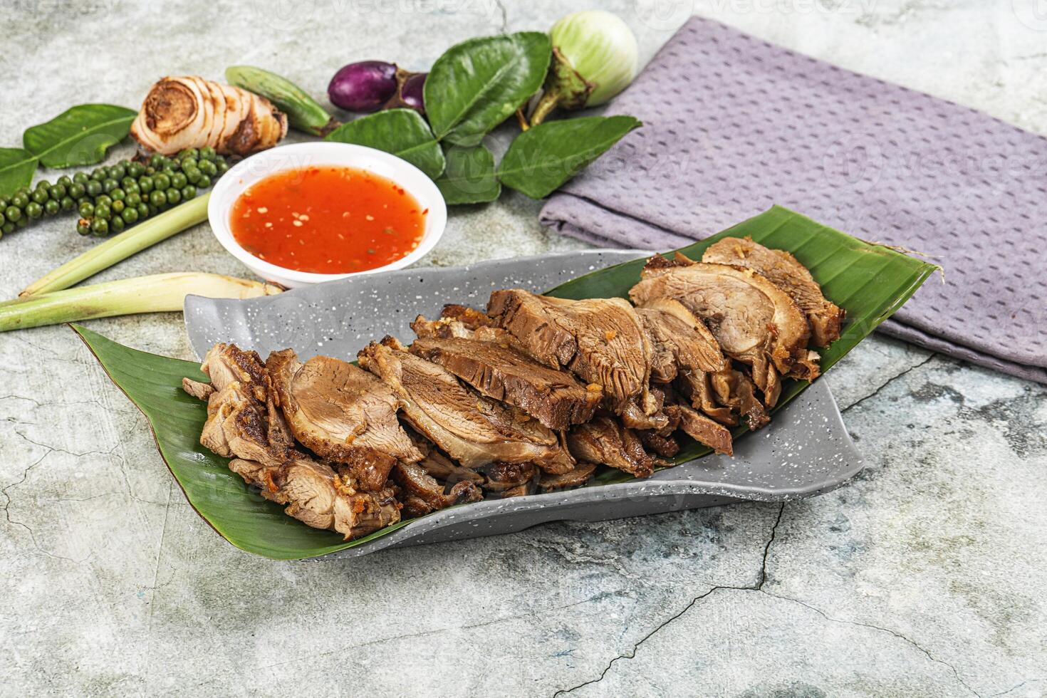 A plate with meat and vegetables on it photo