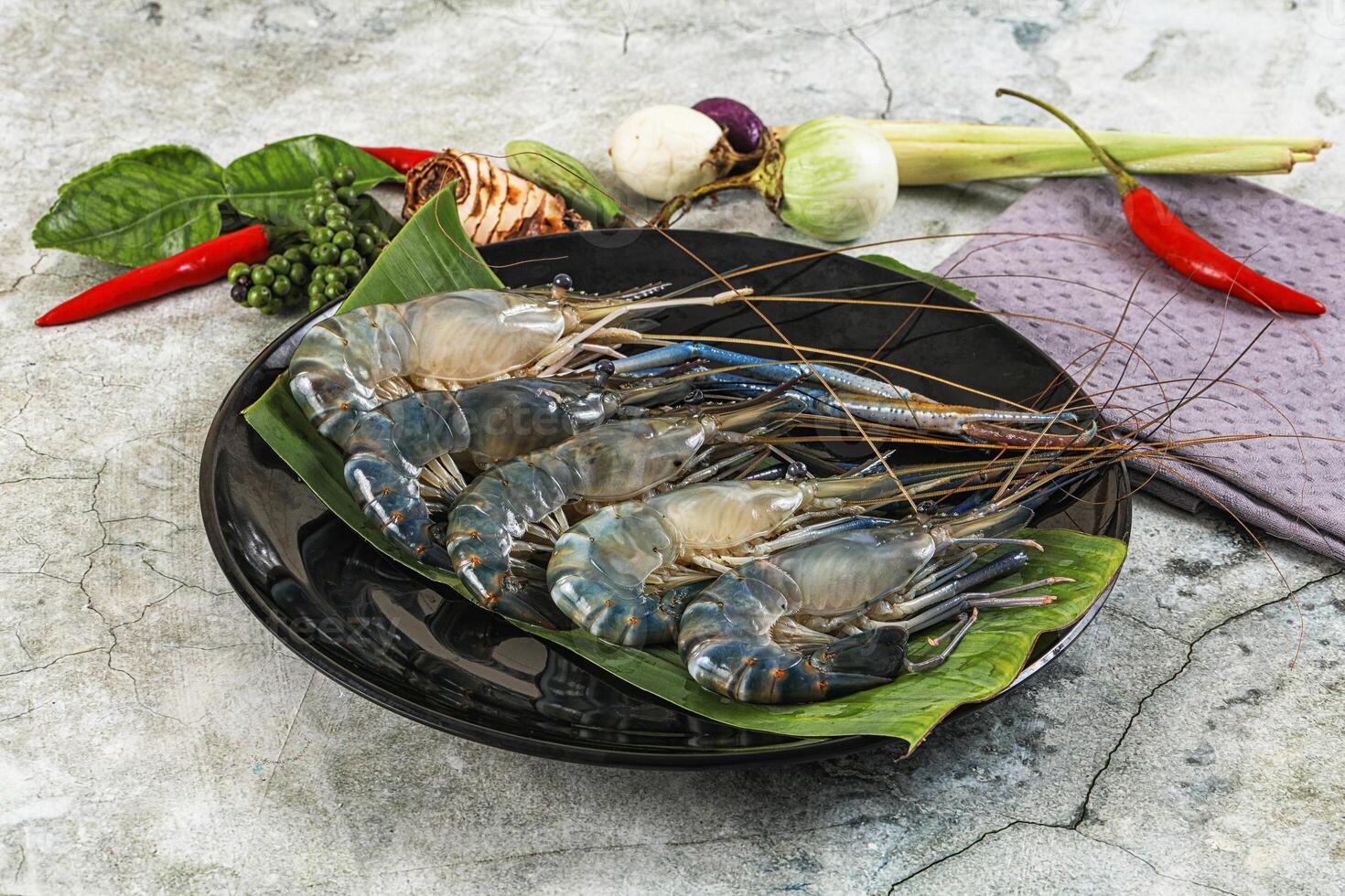 A plate with several shrimp and vegetables photo