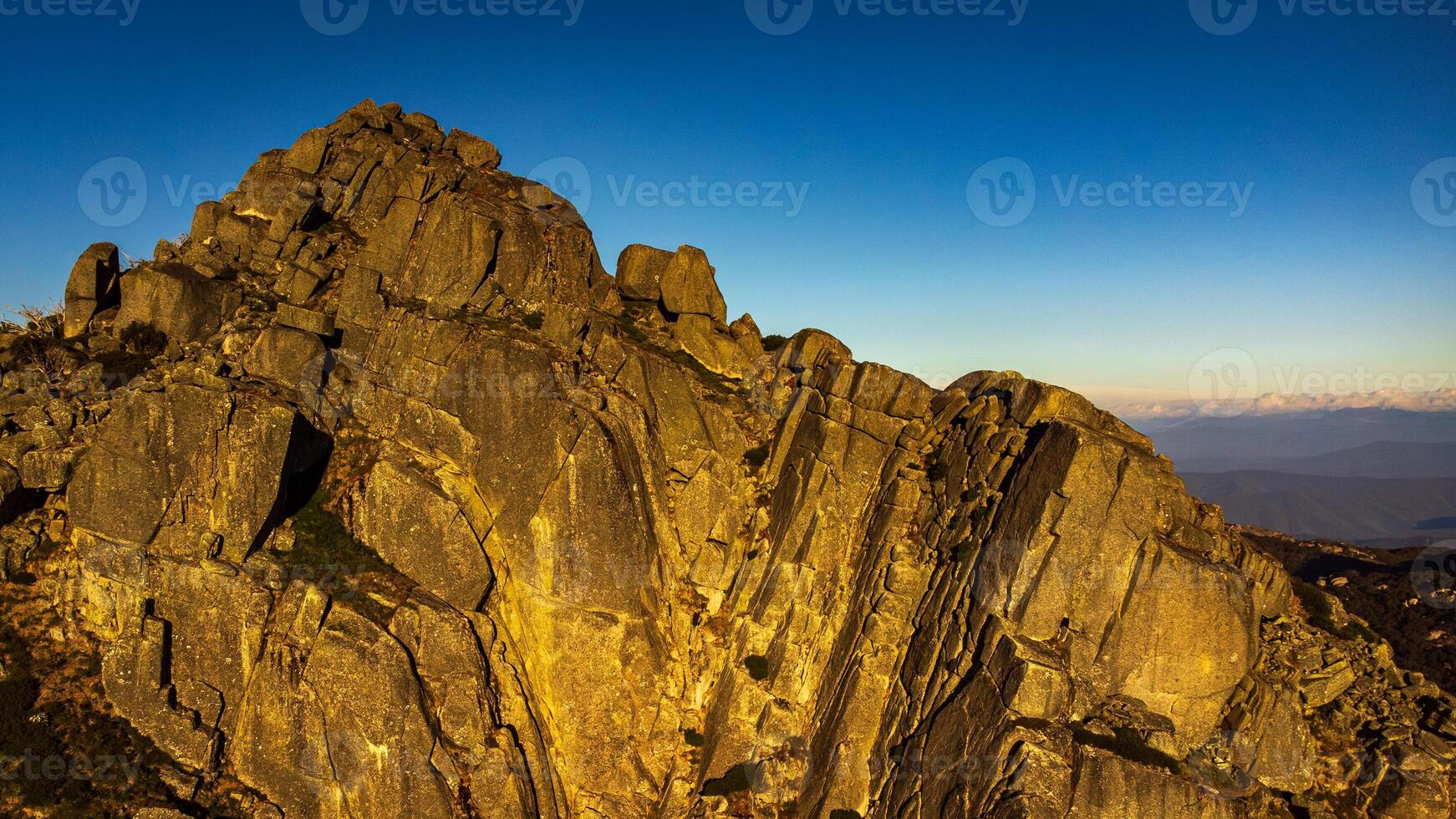 Sunset on granite mountain peak photo