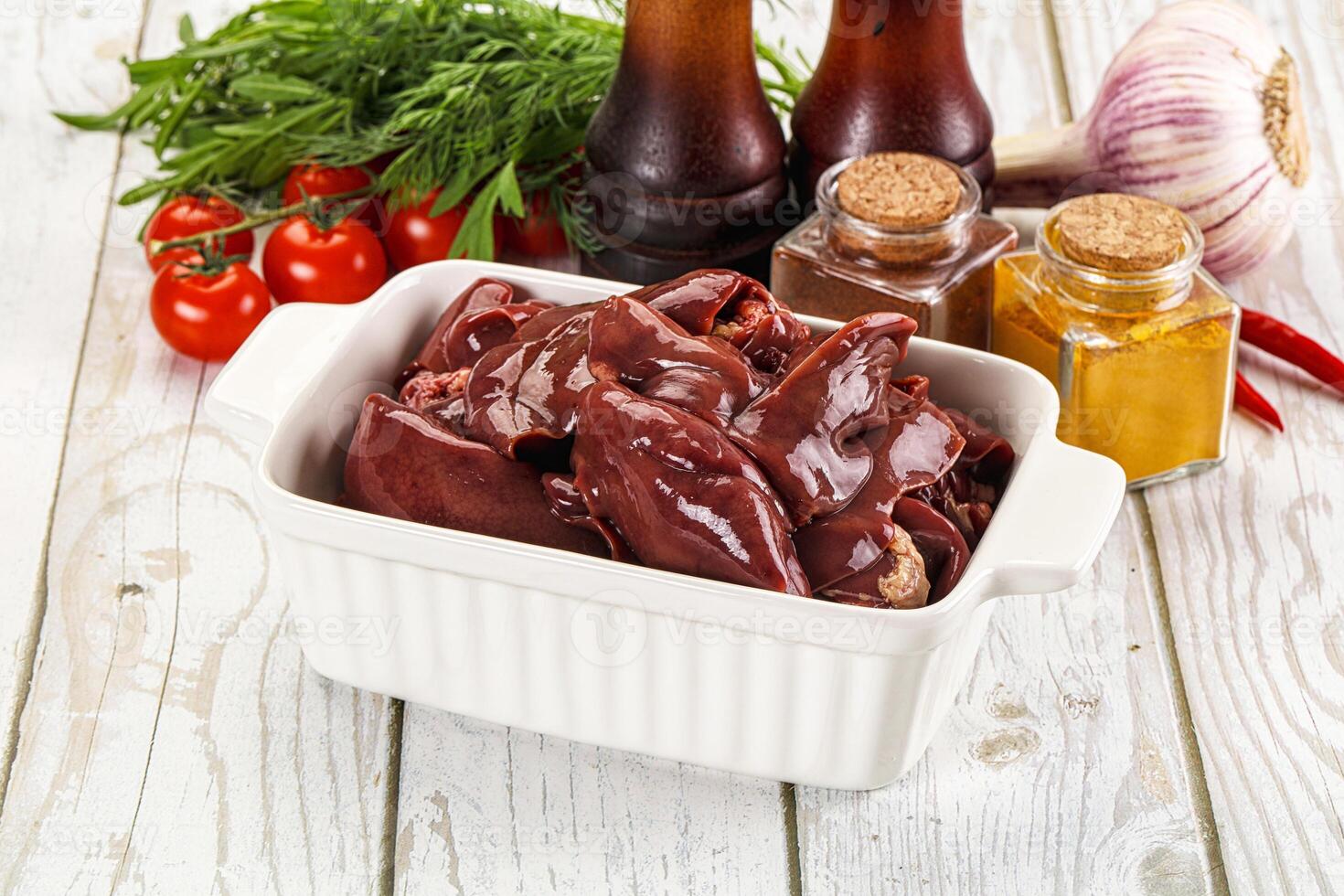 A bowl of meat with spices and other ingredients photo