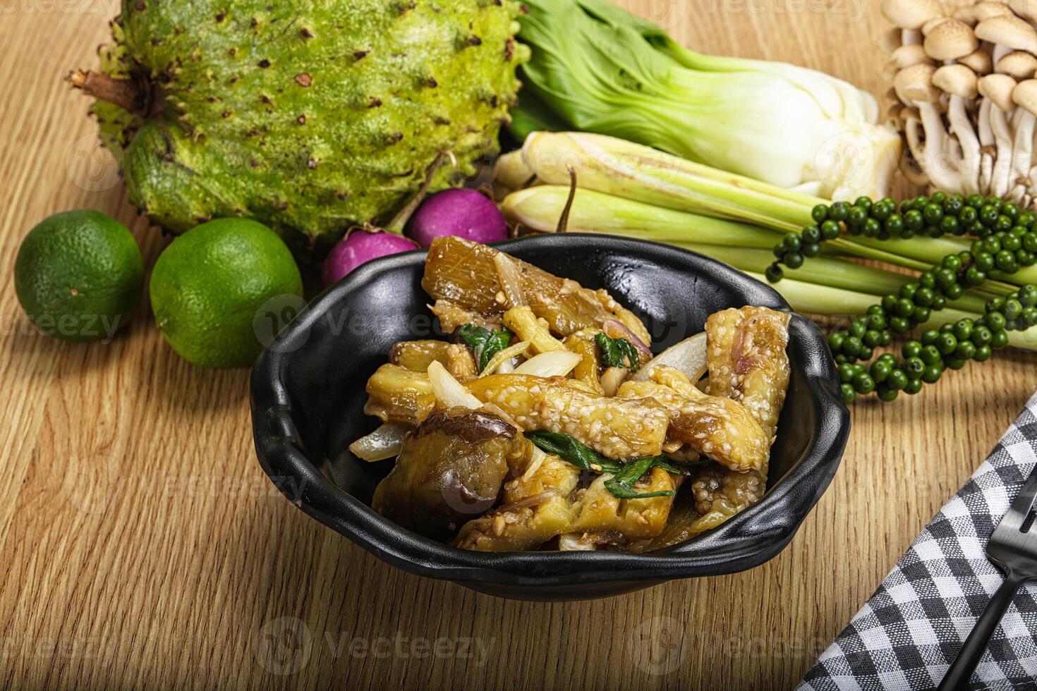 A bowl of food with various vegetables and fruit photo