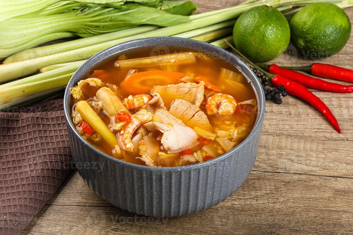A bowl of soup with vegetables and other ingredients photo