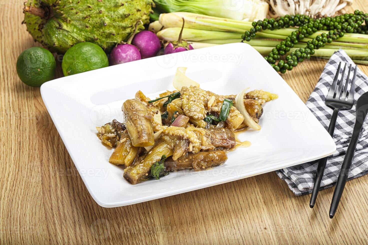 A plate of food with vegetables and fruit on a table photo