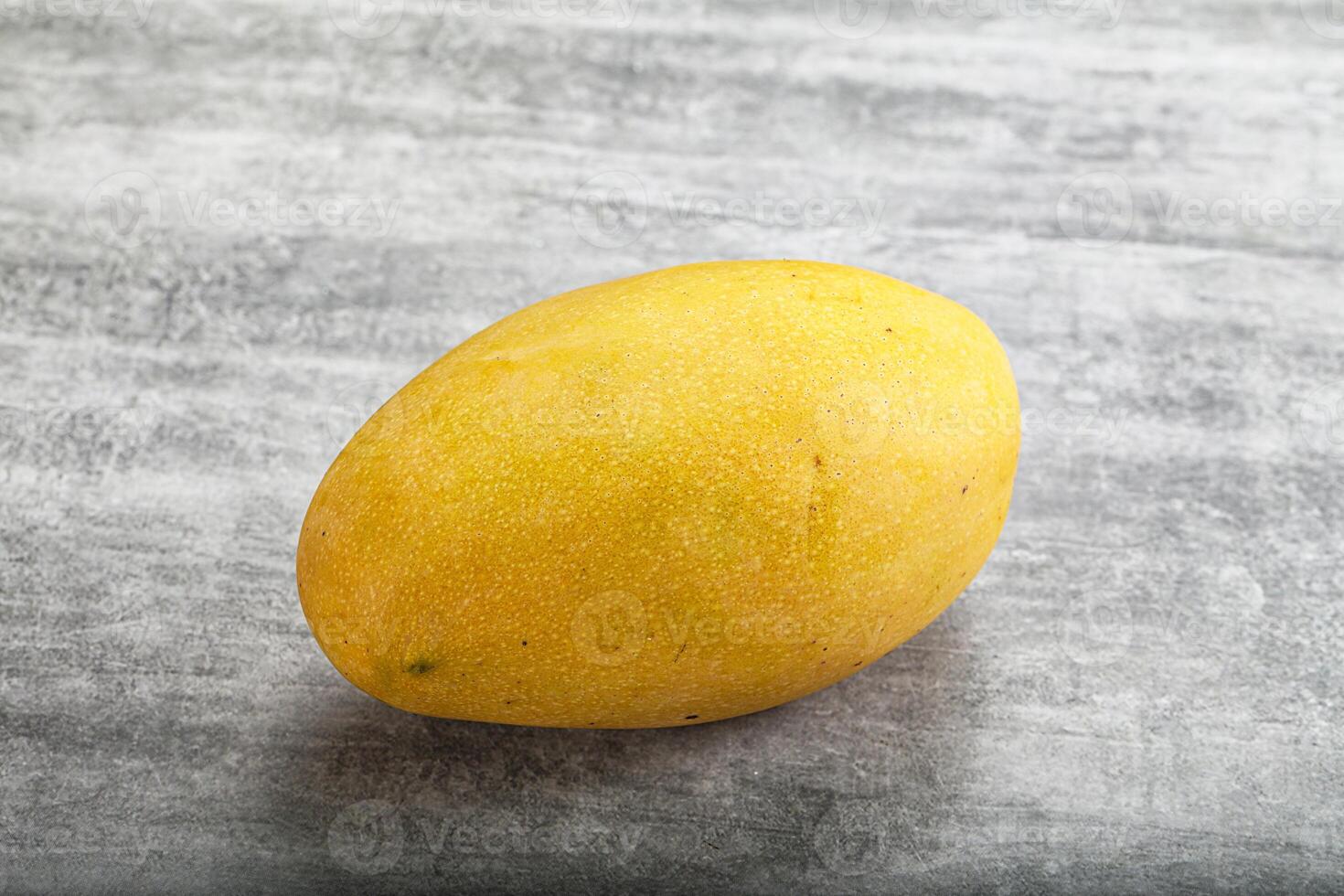 A mango on a table photo