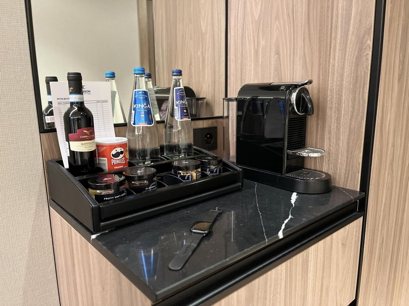 Warsaw, Poland. November 02, 2024. Black Coffee machine sits on a countertop, ready to brew photo