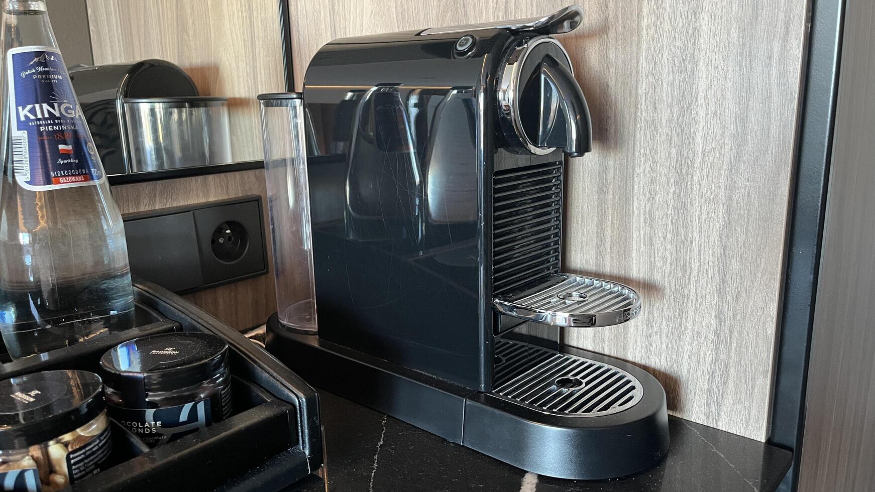 Warsaw, Poland. November 02, 2024. Coffee machine sits on a countertop, ready to brew a delicious cup of coffee photo