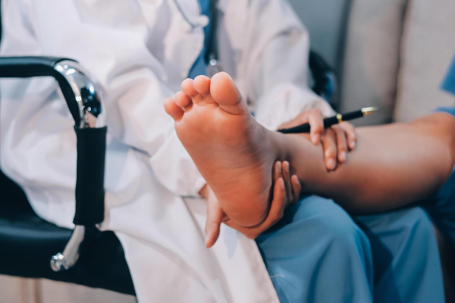 A doctor is examining a patient's foot photo