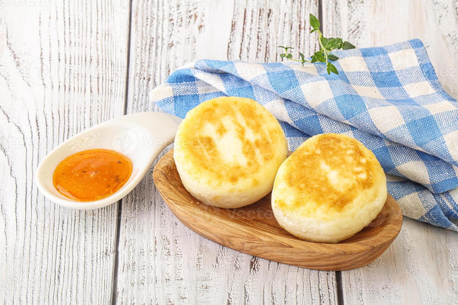 Chinese fried rice with sauce on wooden table photo