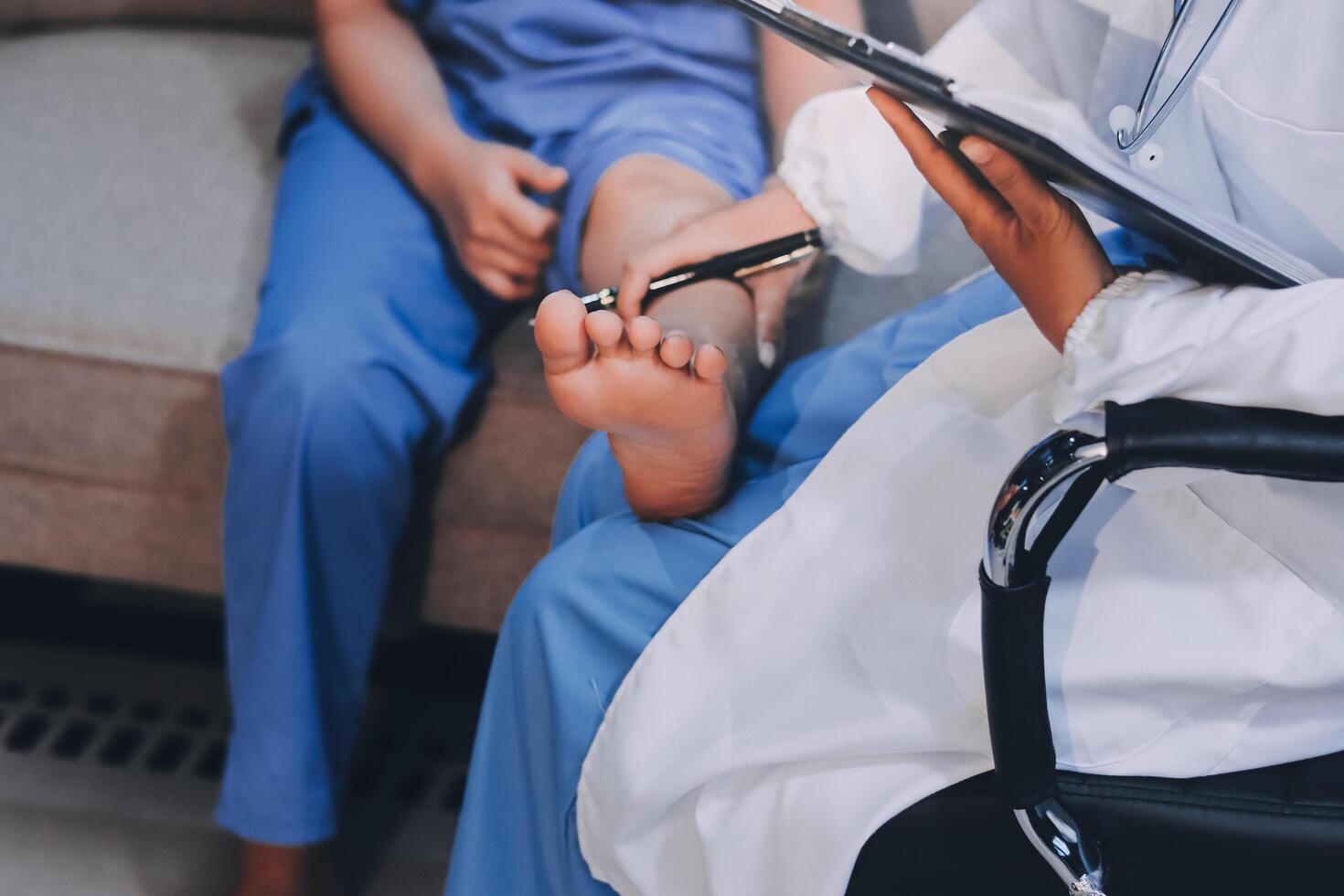 A doctor is examining a patient's foot photo