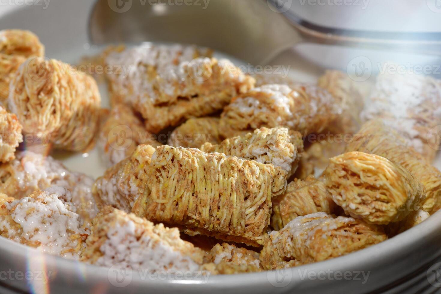 Close-Up of Frosted Mini-Wheats Cereal in Milk photo
