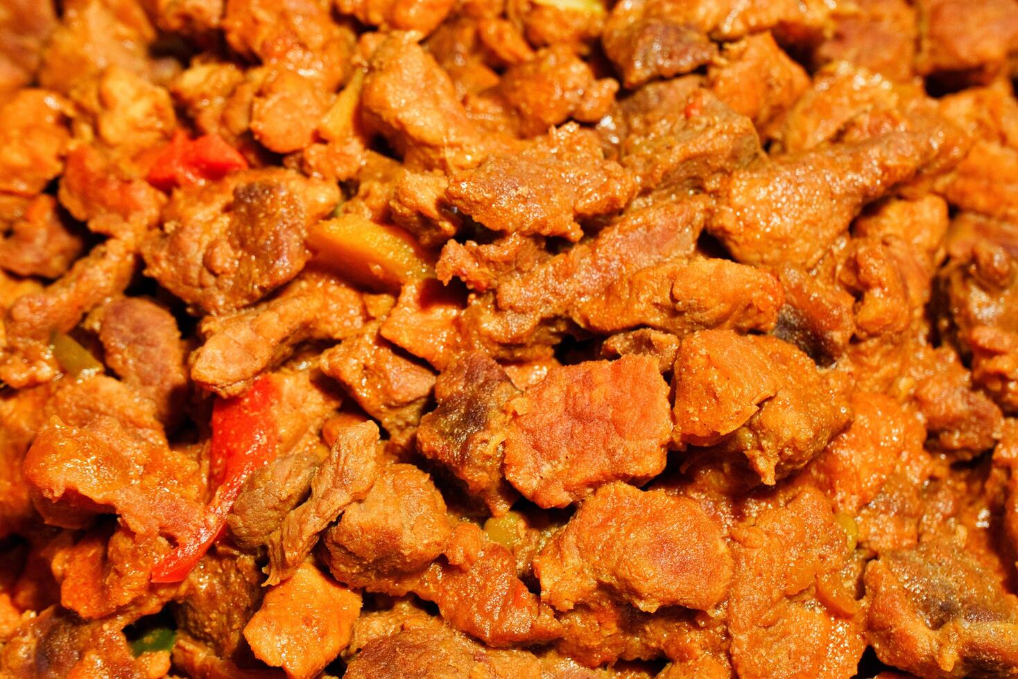 pork afritada dish with bell peppers photo