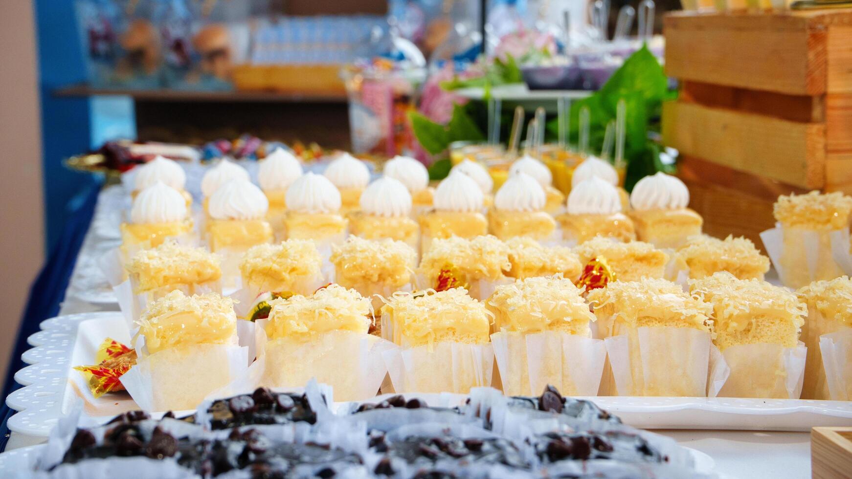 a buffet with cheese cake and other desserts photo