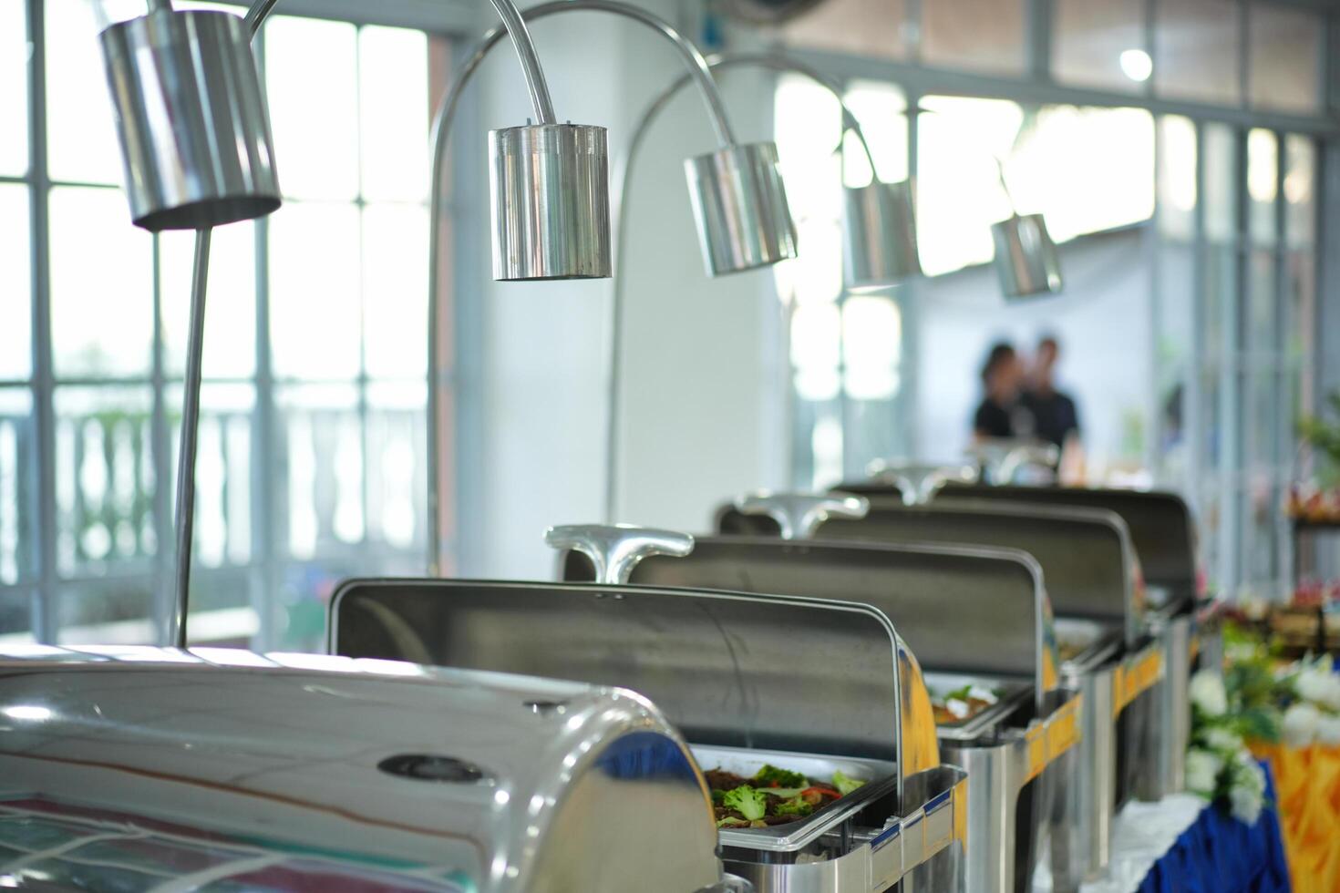 a line of food on a buffet table photo