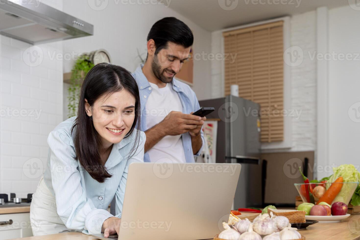 We definitely made some savings. Shot of a couple going over paperwork together at home. photo