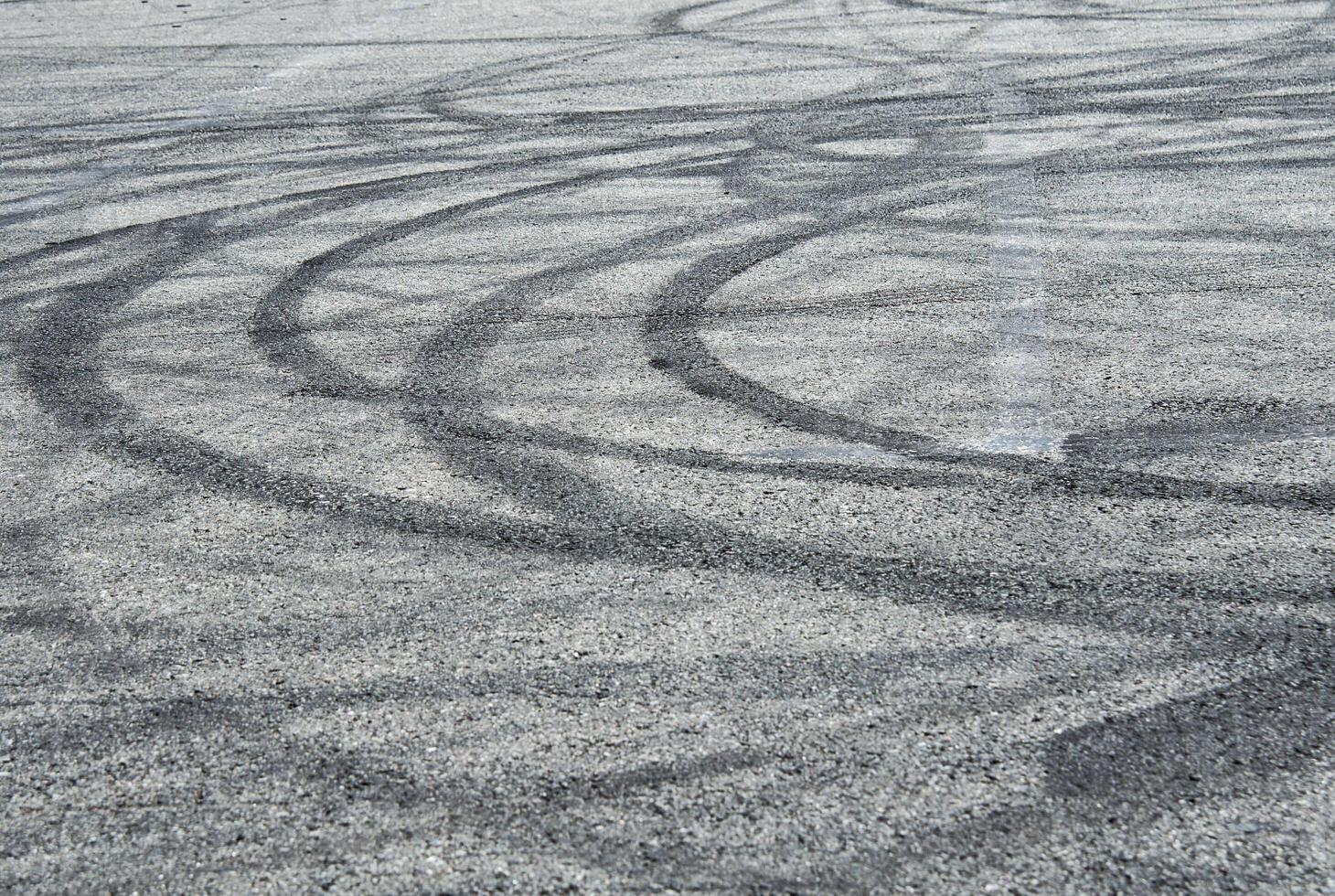 Asphalt with traces of tires photo