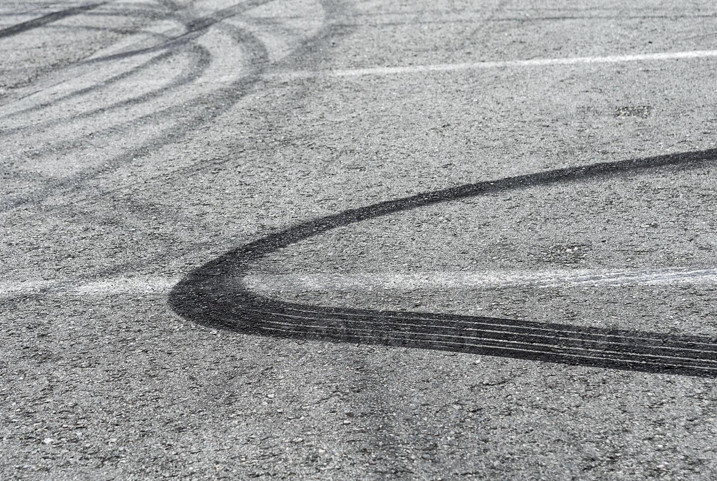 Asphalt with drift traces of tires photo