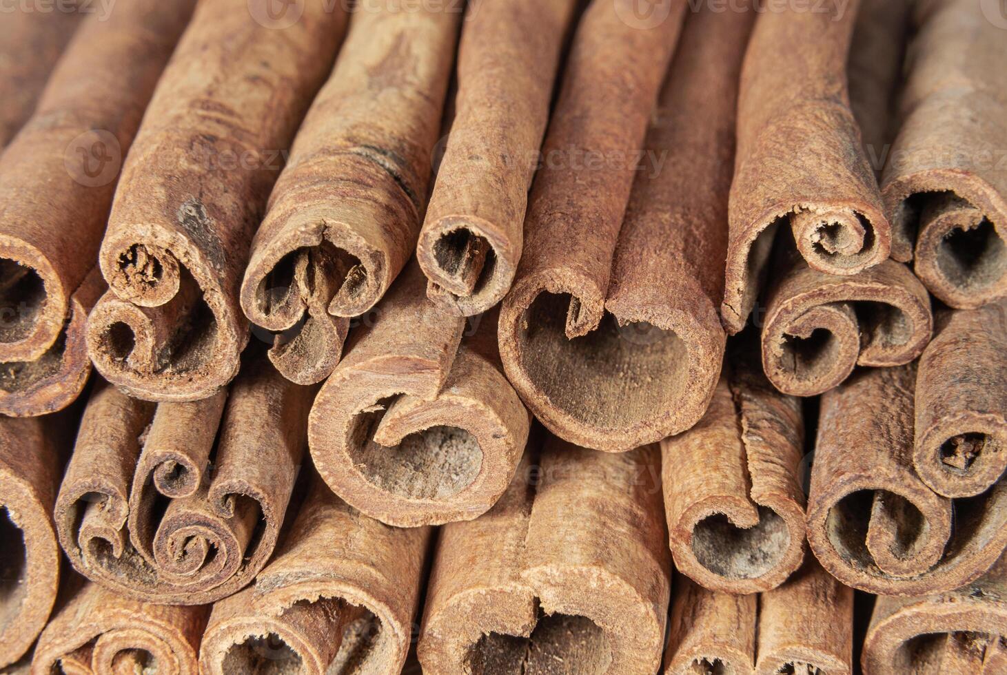 Aromatic cinnamon sticks close up photo