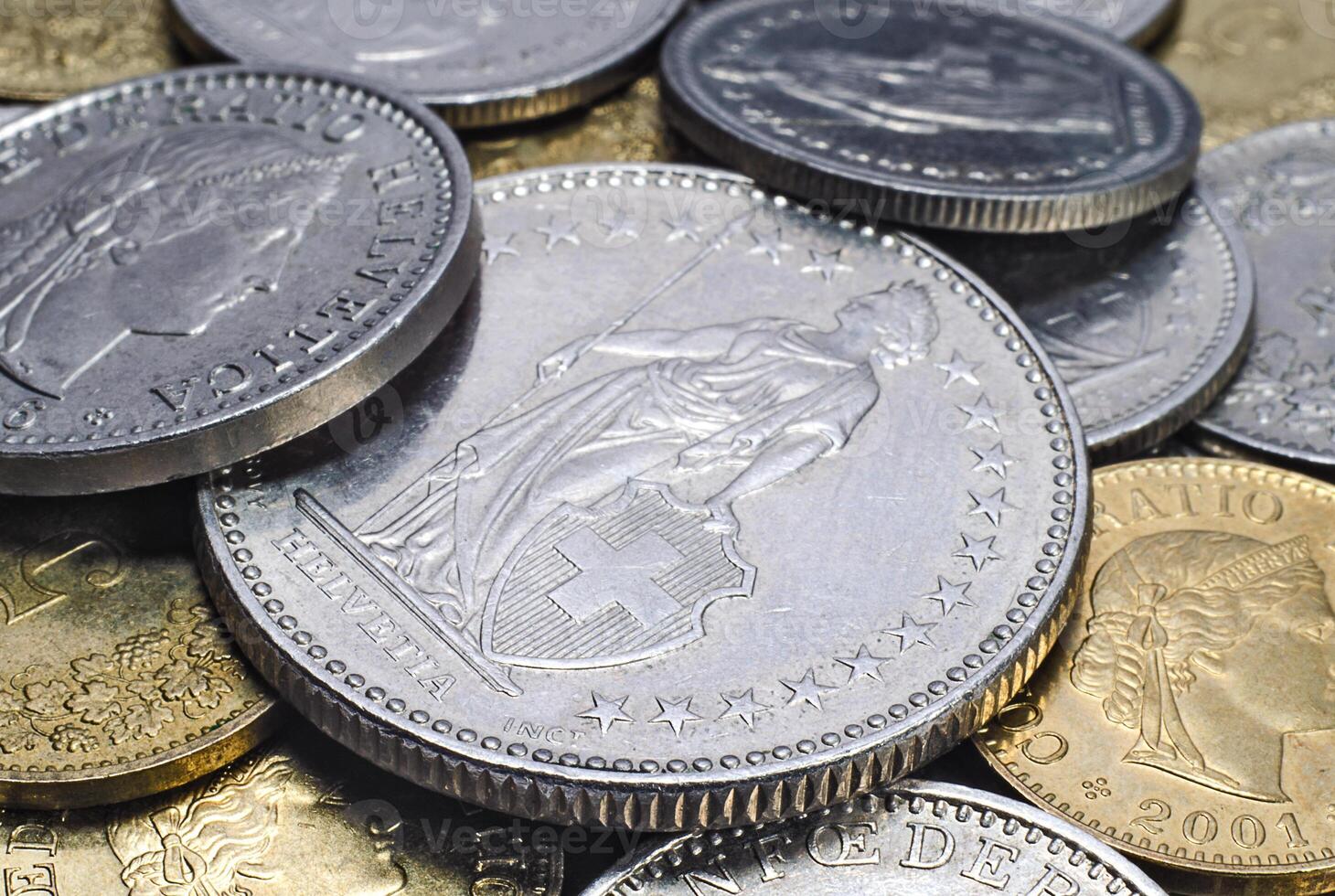 Heap of Swiss coins closeup photo
