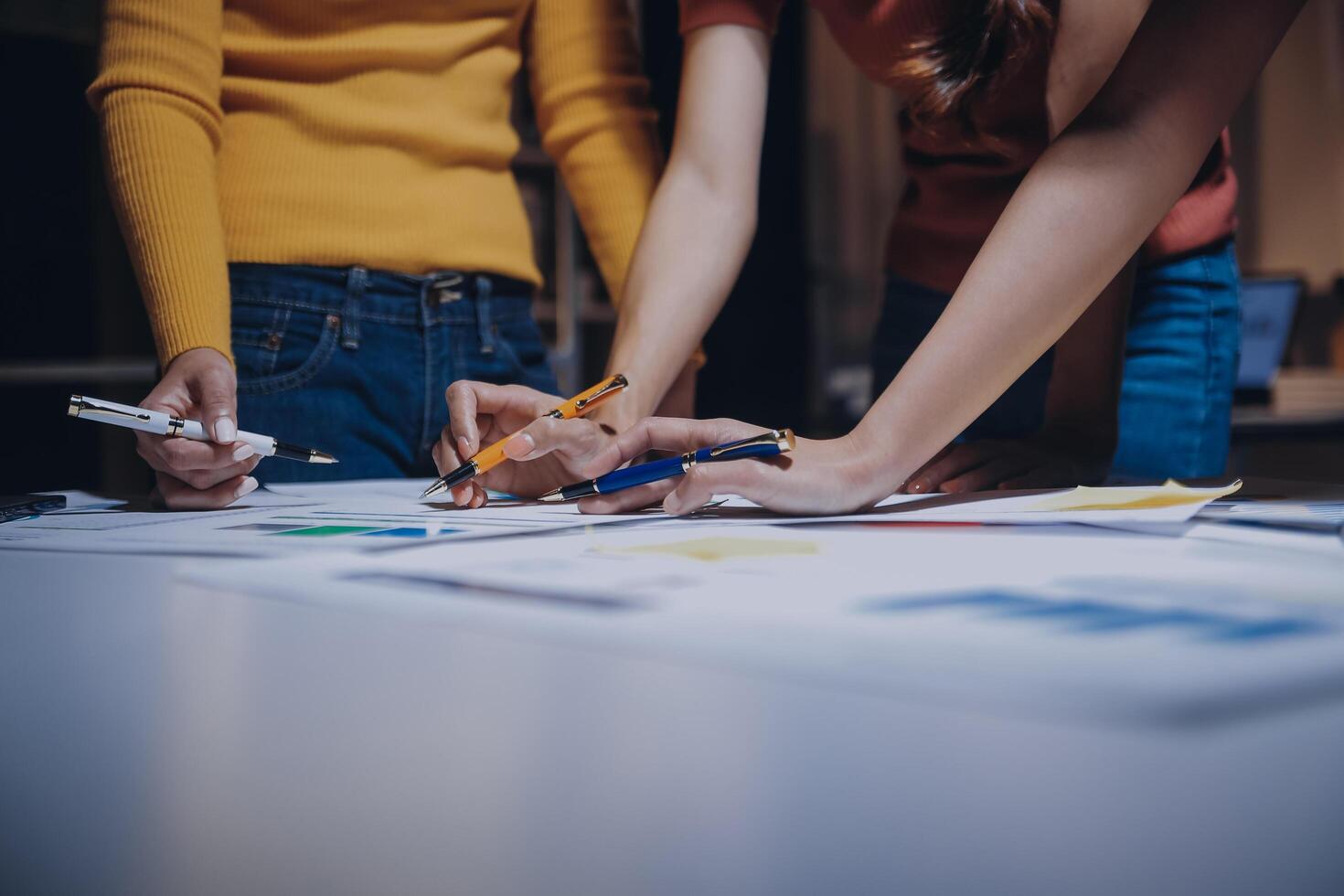Three people working on a project together photo