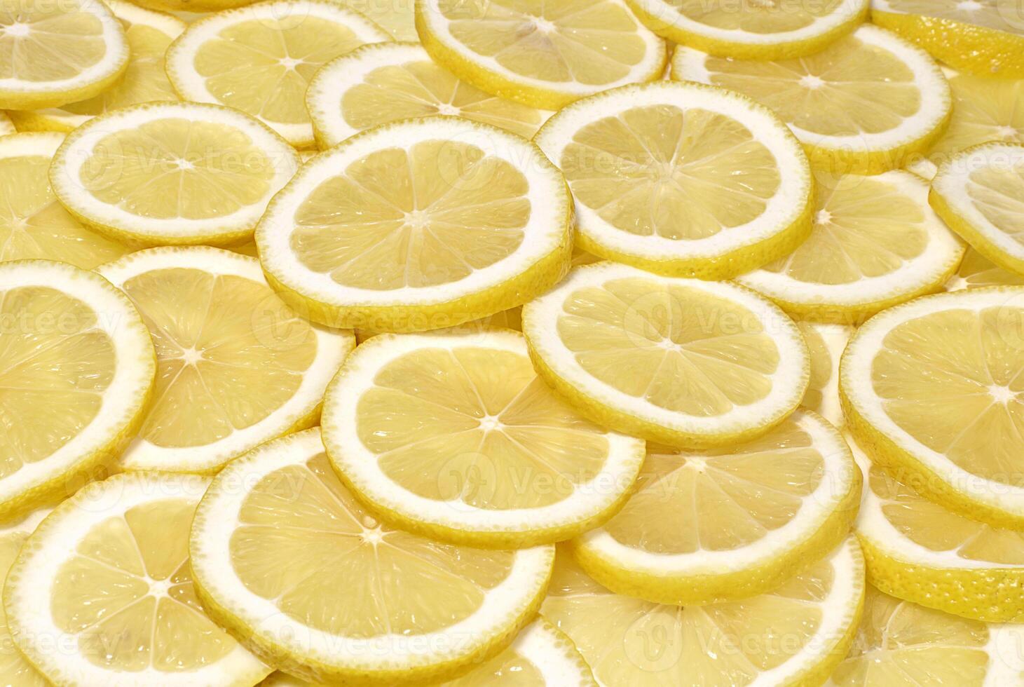 Lemon slices close up background. Fruits and vegetables photo