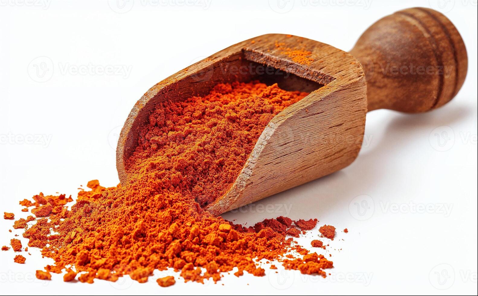 Wooden scoop of paprika powder isolated on white background photo