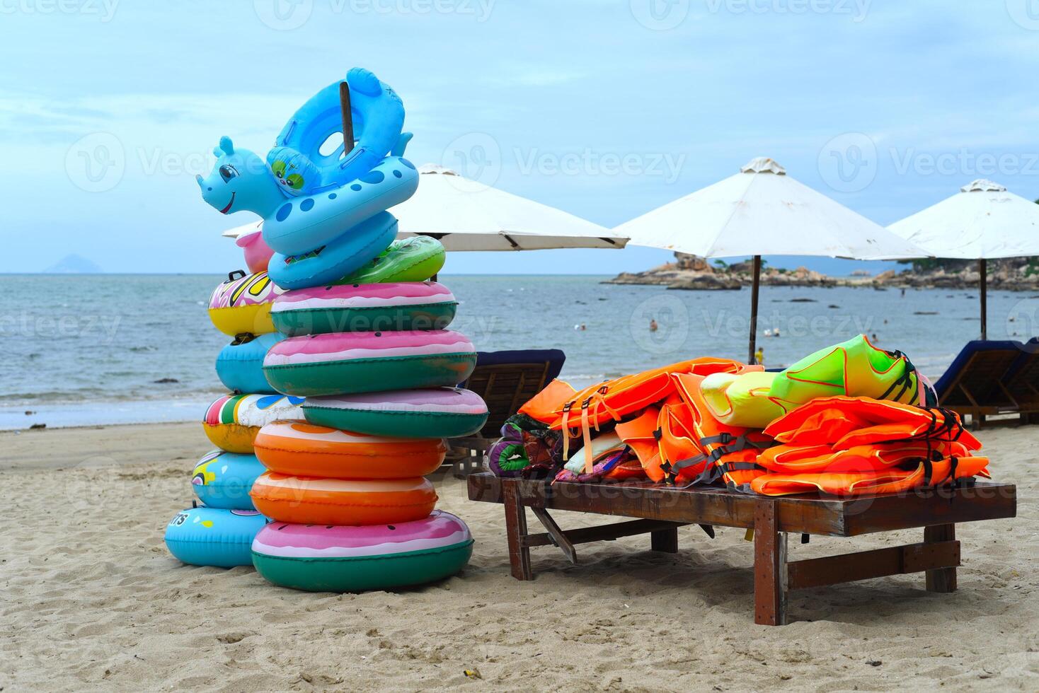 Life vests and lifebuoys on the beach of South China sea of Vietnam Nha trang photo