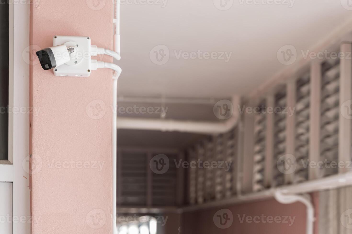 Security Camera on Building. IP CCTV camera install by have water proof cover to protect camera photo