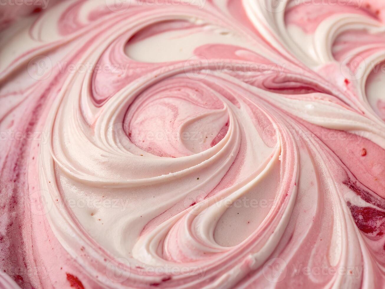 a close up of a bowl of pink and white swirled frosting background photo