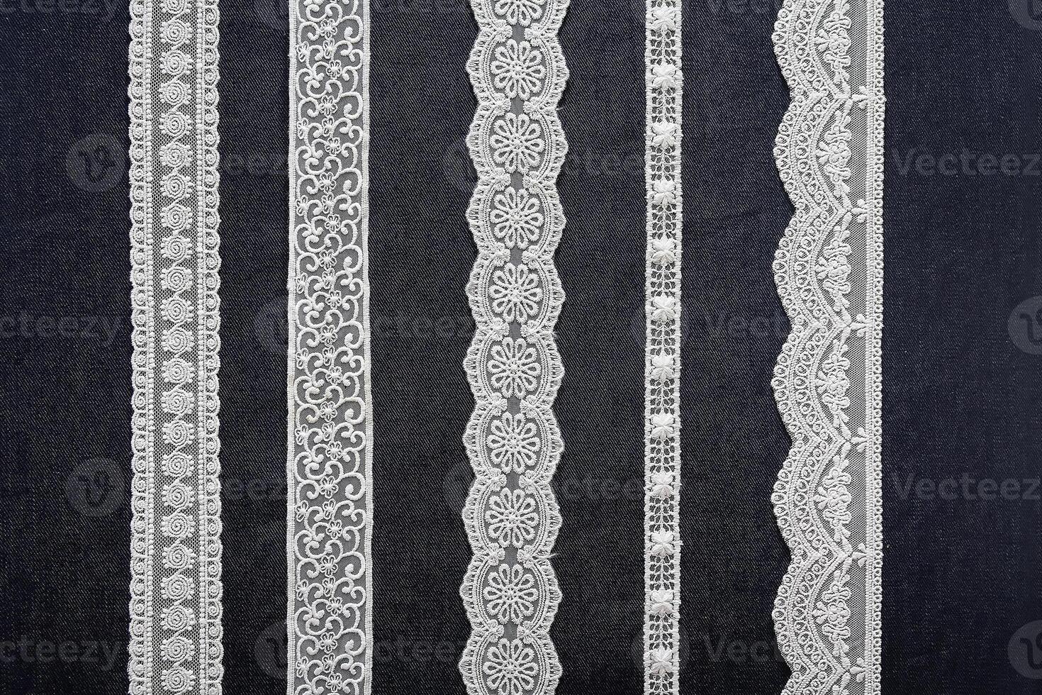 Samples of beautiful elegant lace on a black background photo