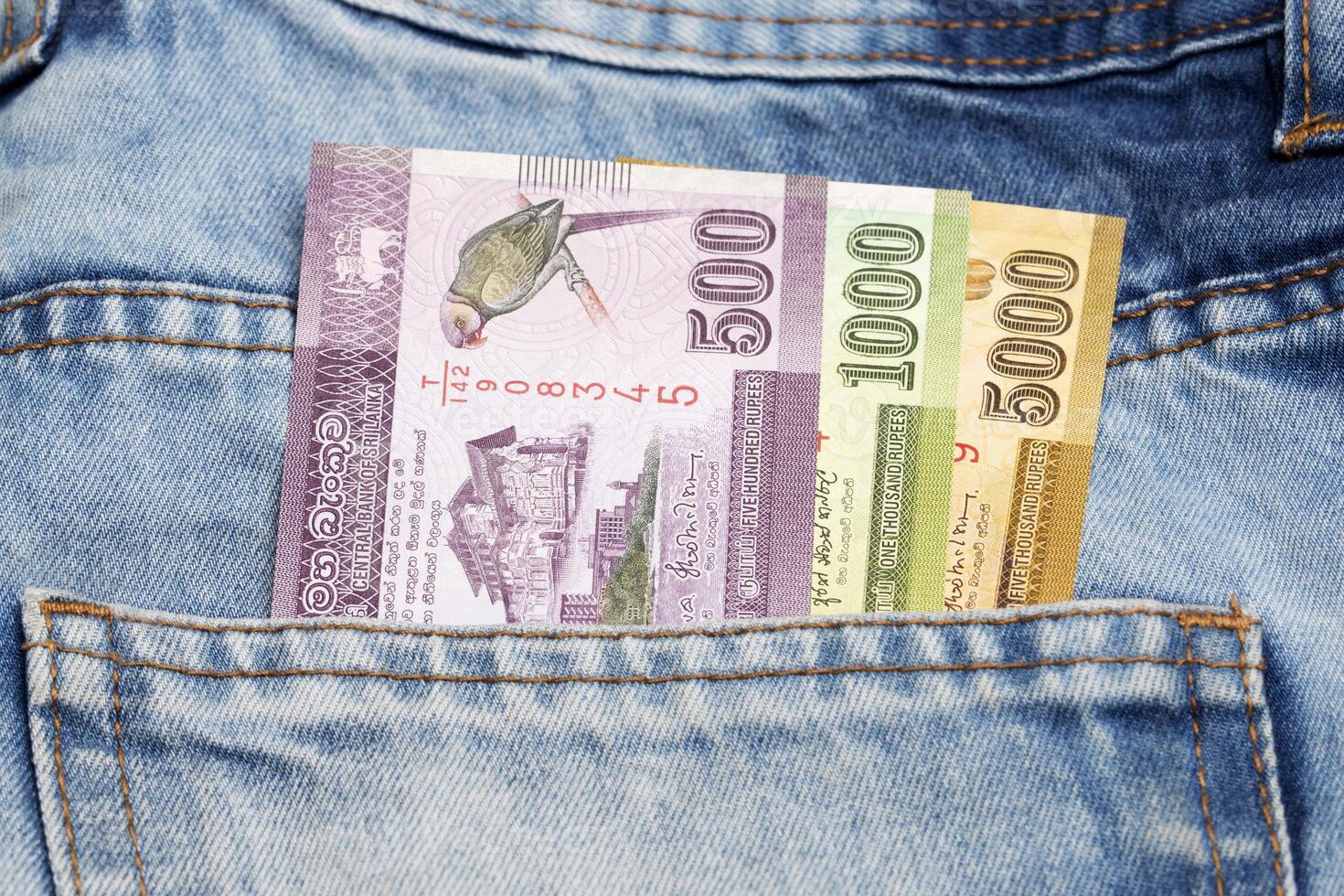 Sri Lankan money - rupee in the pocket of blue jeans photo