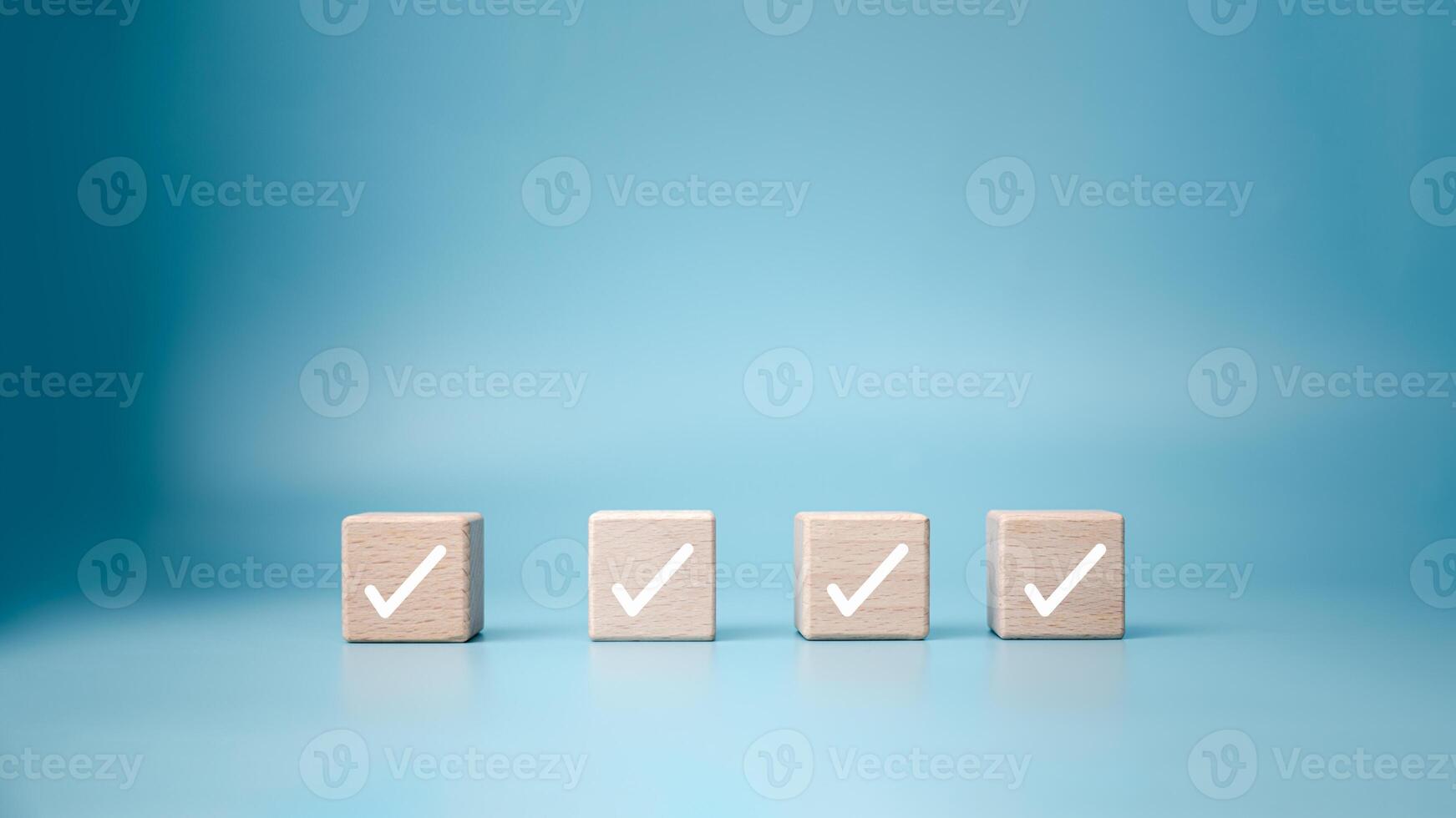 Checklist, Task list, Process success, Solving solution, Mission complete, Survey and assessment and voting, Quality Control, Goal achievement business, White correct check mark on wooden blocks. photo