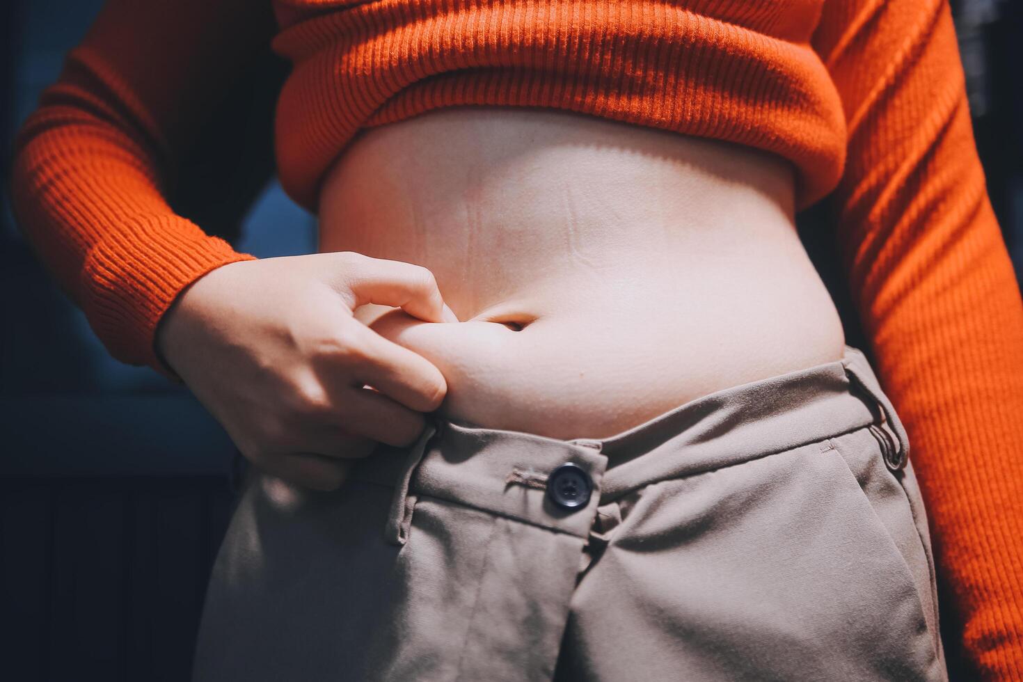 A woman with a belly showing off her belly photo