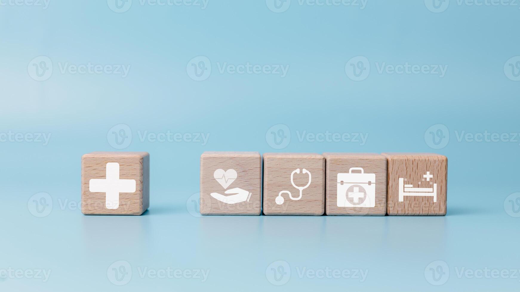 Health insurance and medical care concept, Medical care, Health insurance and medication. healthcare services, protection, Insurance coverage, A set of wooden blocks displaying health-related icons. photo